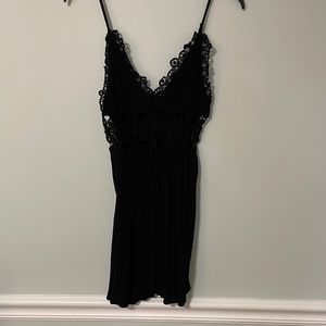Mini black dress with lace cutouts. Forever 21 brand